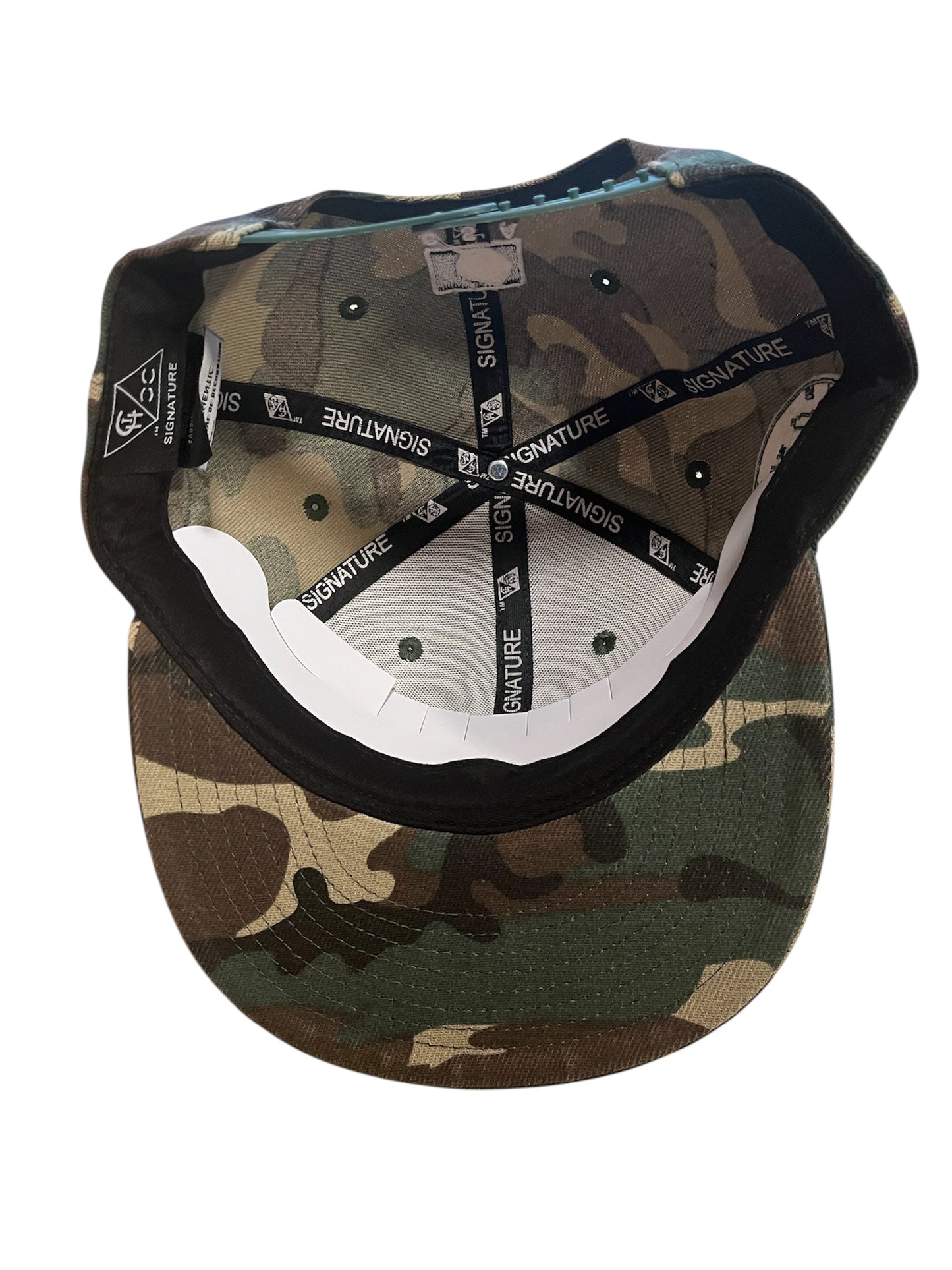 ARMY GREEN CAMOUFLAGE CHI SIGNATURE SNAPBACK WITH LOGO WORDS UNDER BRIM ON WHITE BACKGROUND